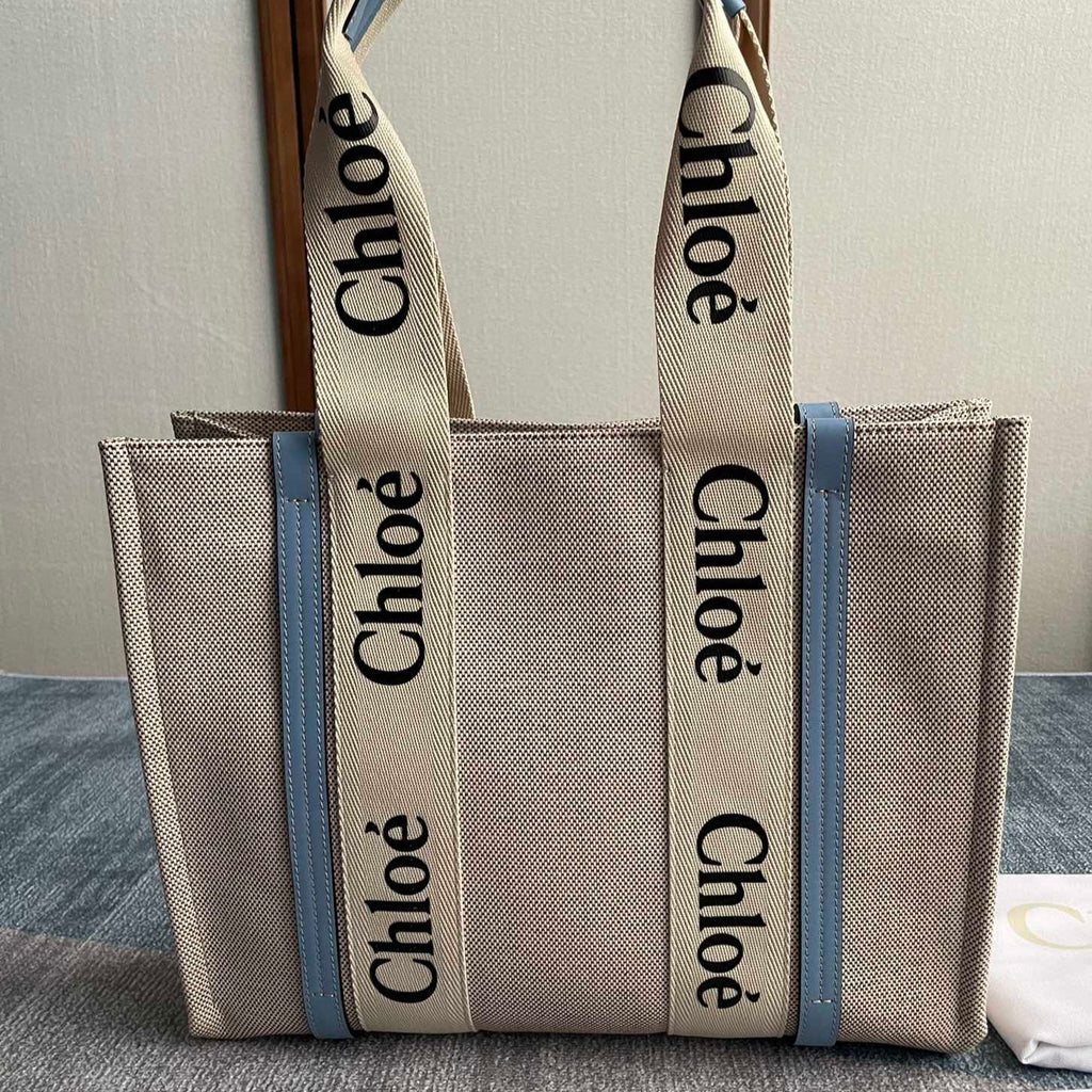 Medium Strap Woody Tote Bag 37 in Beige Linen Canvas Black Webbing Logo Embroider Blue Calfskin