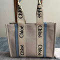 Medium Strap Woody Tote Bag 37 in Beige Linen Canvas Black Webbing Logo Embroider Blue Calfskin