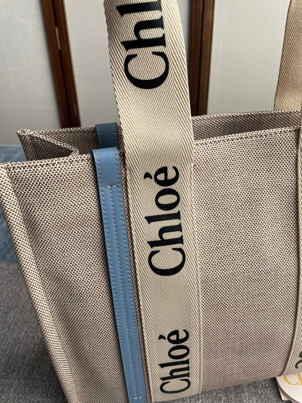 Medium Strap Woody Tote Bag 37 in Beige Linen Canvas Black Webbing Logo Embroider Blue Calfskin