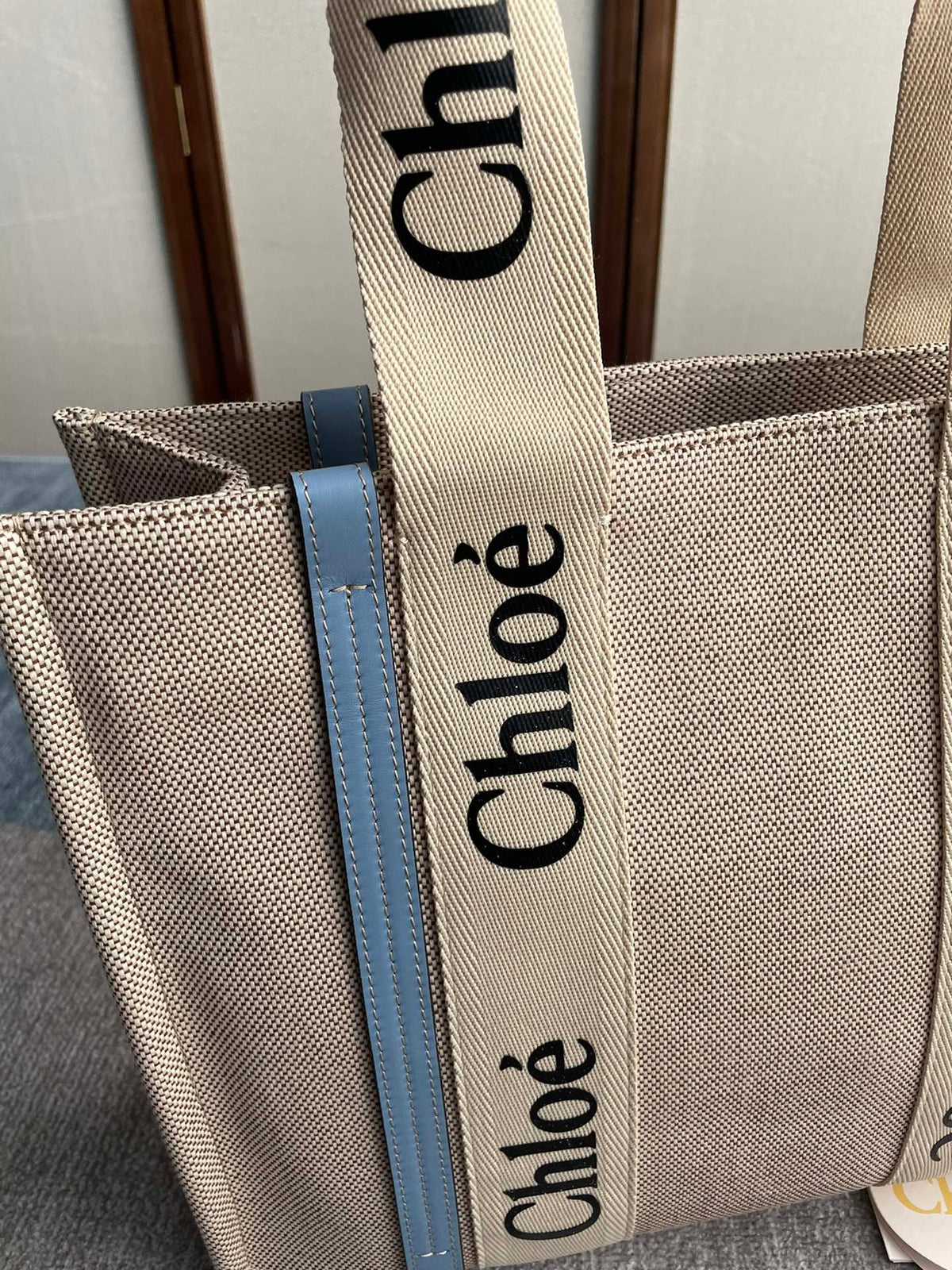 Medium Strap Woody Tote Bag 37 in Beige Linen Canvas Black Webbing Logo Embroider Blue Calfskin
