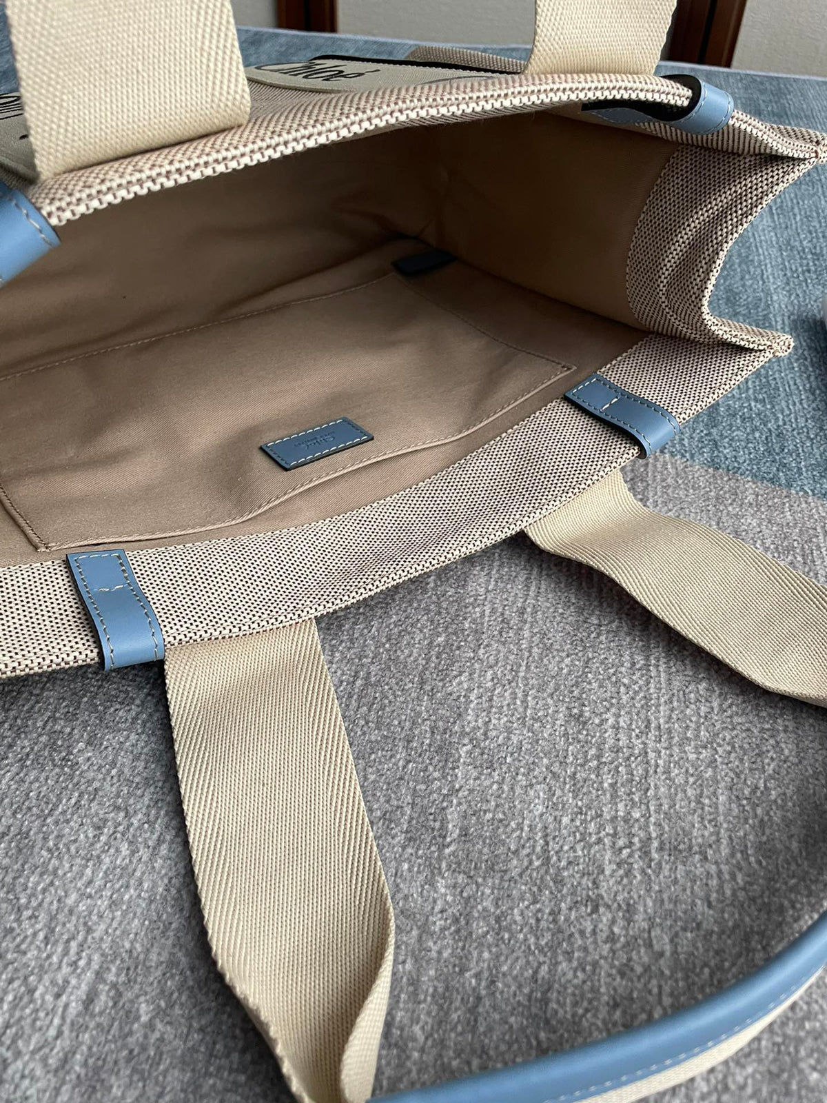 Medium Strap Woody Tote Bag 37 in Beige Linen Canvas Black Webbing Logo Embroider Blue Calfskin
