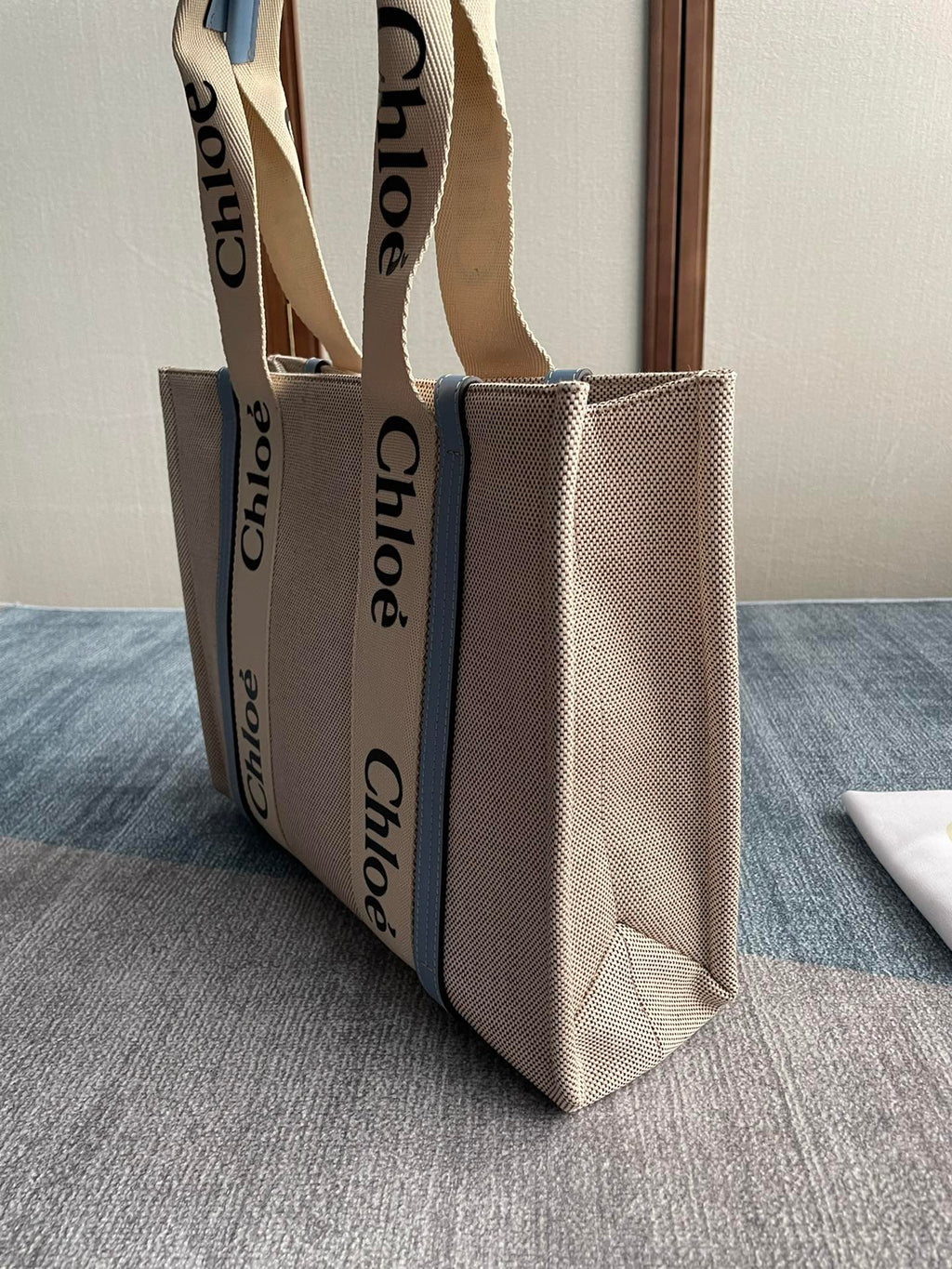 Medium Strap Woody Tote Bag 37 in Beige Linen Canvas Black Webbing Logo Embroider Blue Calfskin