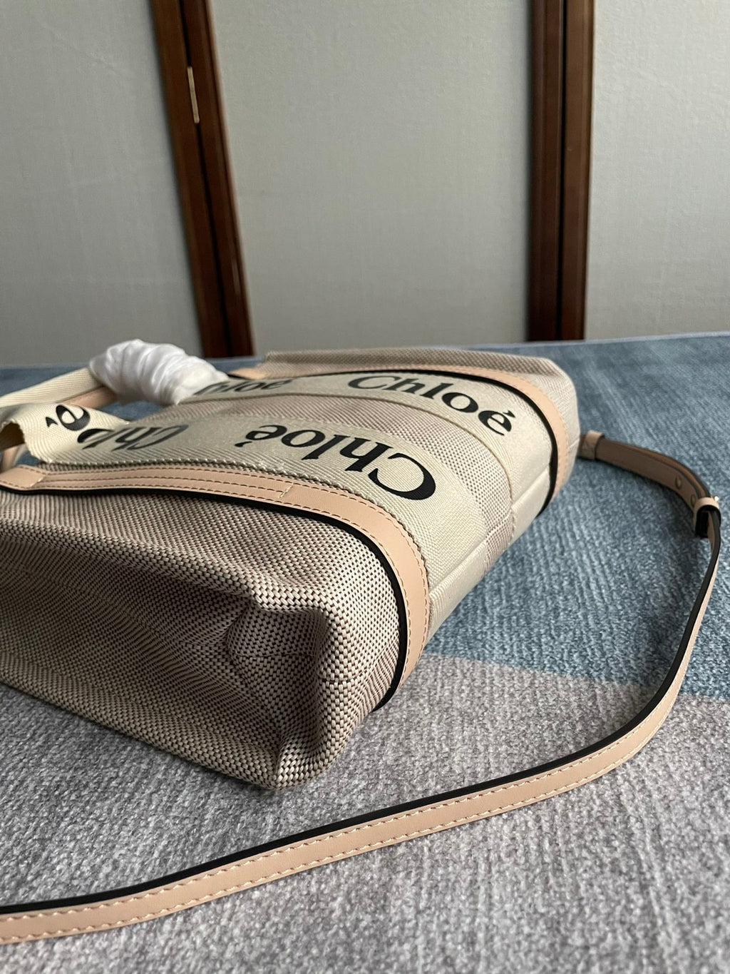 Small Strap Woody Tote Bag 26.5 in Beige Linen Canvas Black Webbing Logo Embroider Nude Calfskin