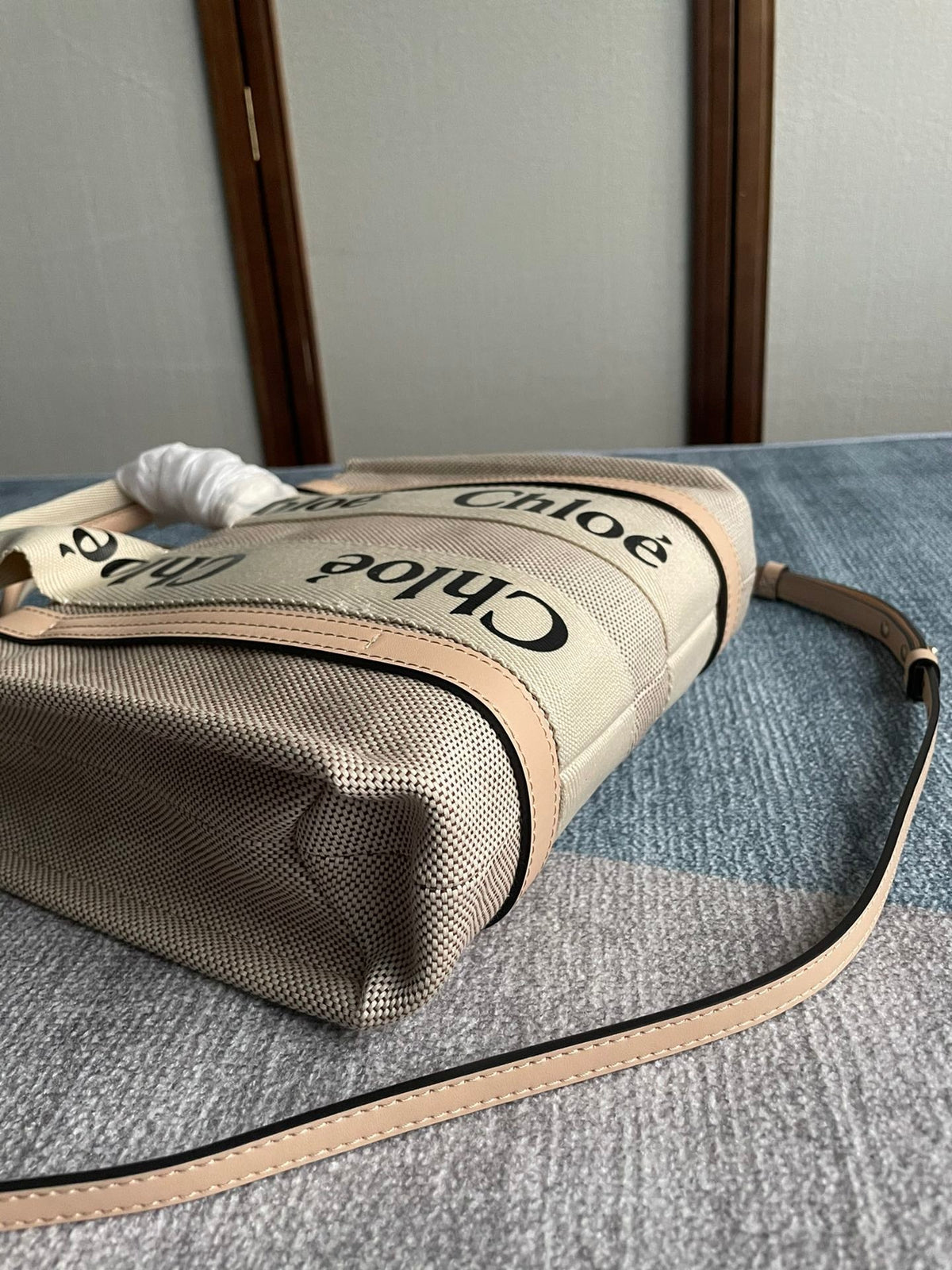 Small Strap Woody Tote Bag 26.5 in Beige Linen Canvas Black Webbing Logo Embroider Nude Calfskin