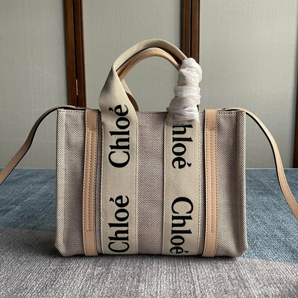 Small Strap Woody Tote Bag 26.5 in Beige Linen Canvas Black Webbing Logo Embroider Nude Calfskin