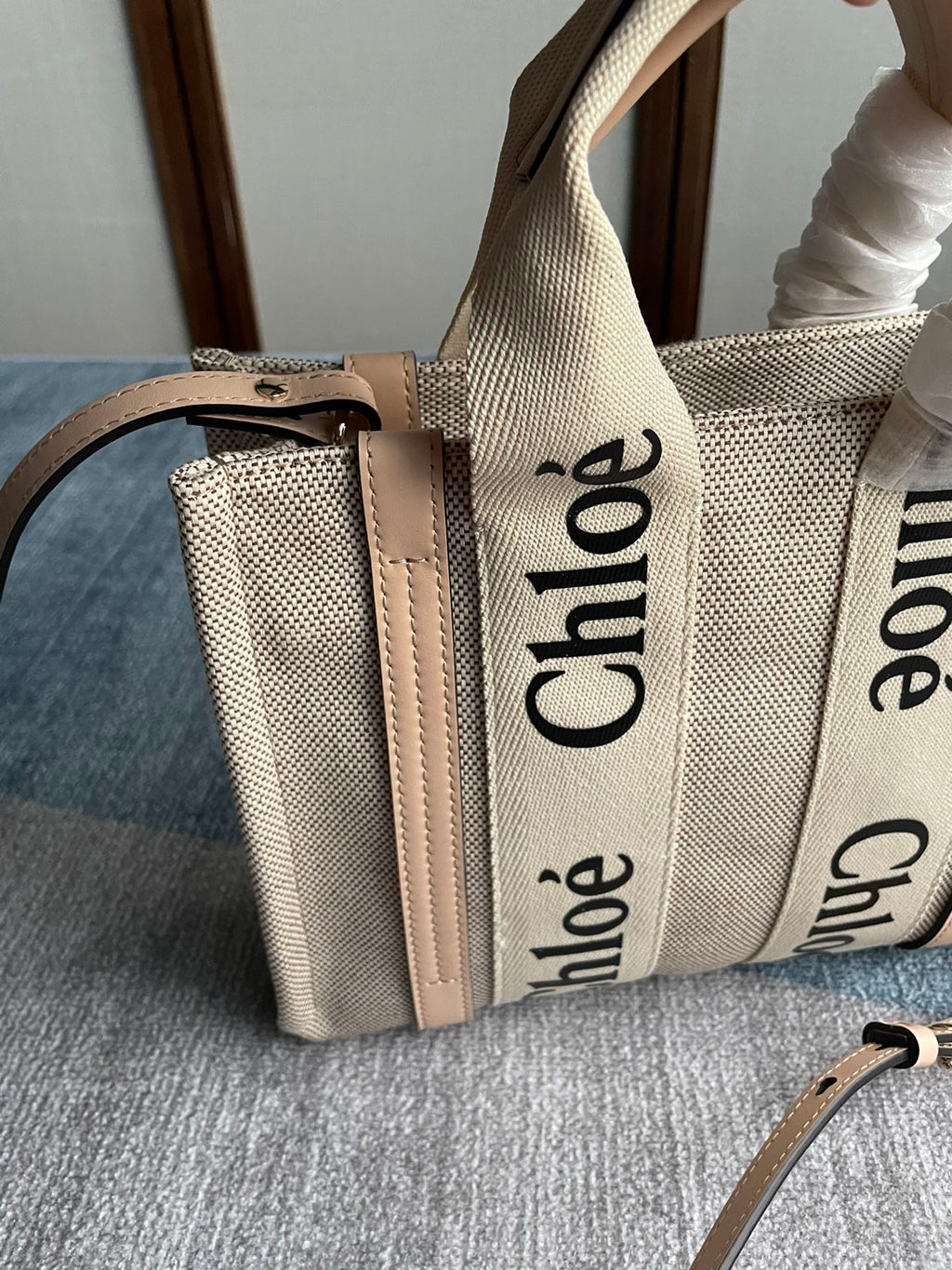 Small Strap Woody Tote Bag 26.5 in Beige Linen Canvas Black Webbing Logo Embroider Nude Calfskin