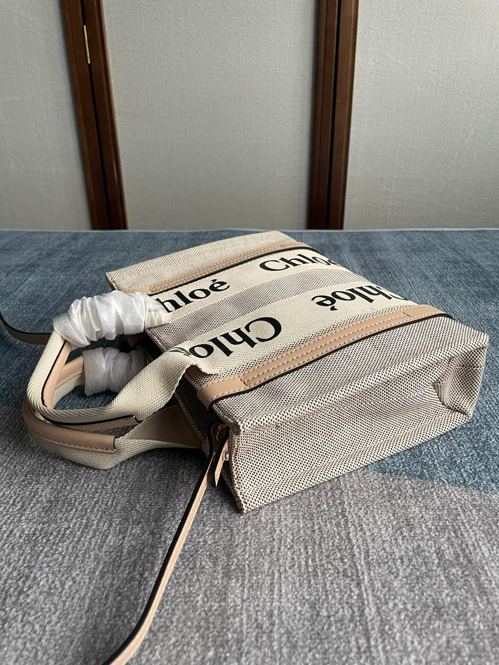 Small Strap Woody Tote Bag 26.5 in Beige Linen Canvas Black Webbing Logo Embroider Nude Calfskin