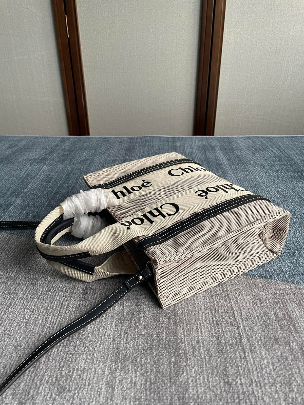 Small Strap Woody Tote Bag 26.5 in Beige Linen Canvas Black Webbing Logo Embroider Black Calfskin