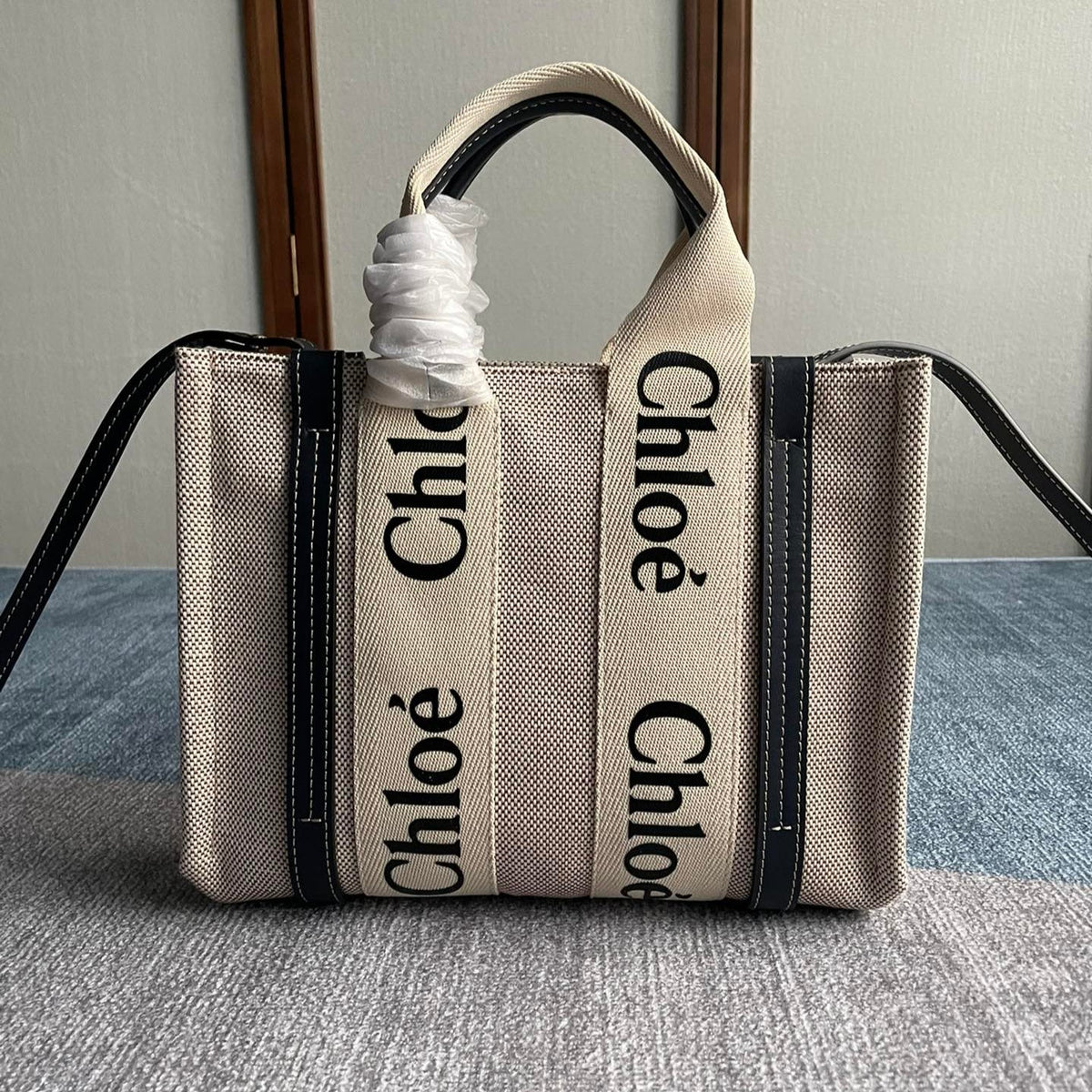 Small Strap Woody Tote Bag 26.5 in Beige Linen Canvas Black Webbing Logo Embroider Black Calfskin