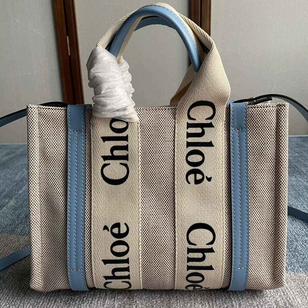 Small Strap Woody Tote Bag 26.5 in Beige Linen Canvas Black Webbing Logo Embroider Blue Calfskin