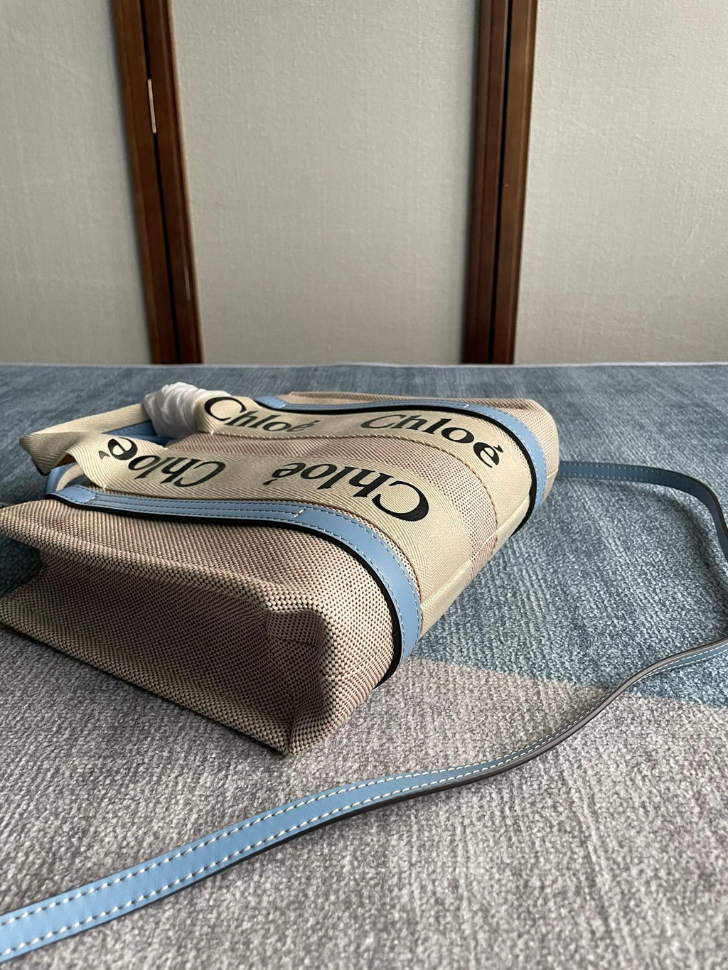 Small Strap Woody Tote Bag 26.5 in Beige Linen Canvas Black Webbing Logo Embroider Blue Calfskin