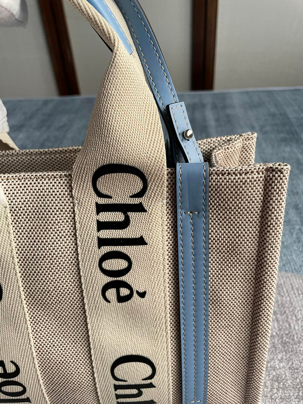 Small Strap Woody Tote Bag 26.5 in Beige Linen Canvas Black Webbing Logo Embroider Blue Calfskin