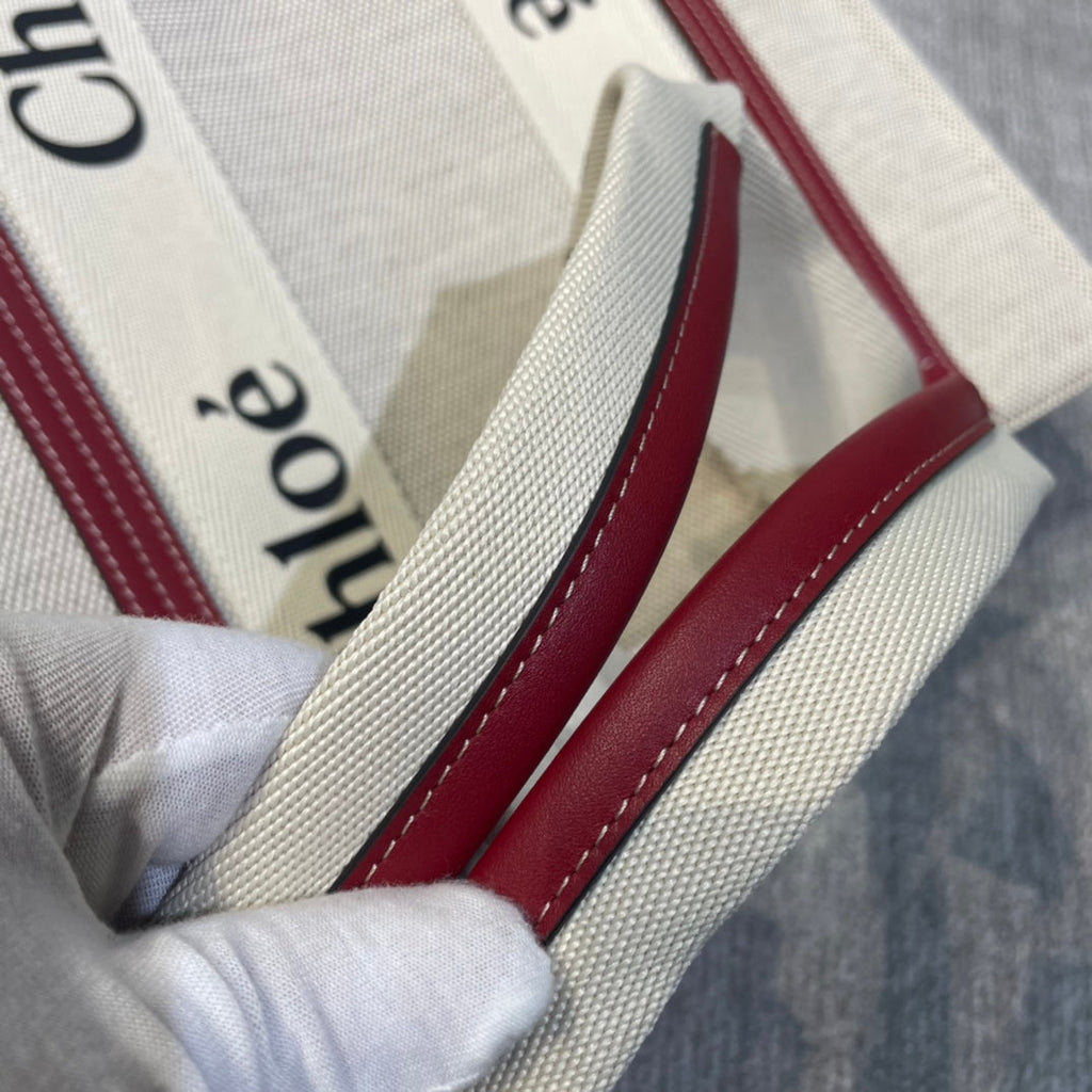 Medium Strap Woody Tote Bag 37 in Beige Linen Canvas Black Webbing Logo Embroider Red Calfskin