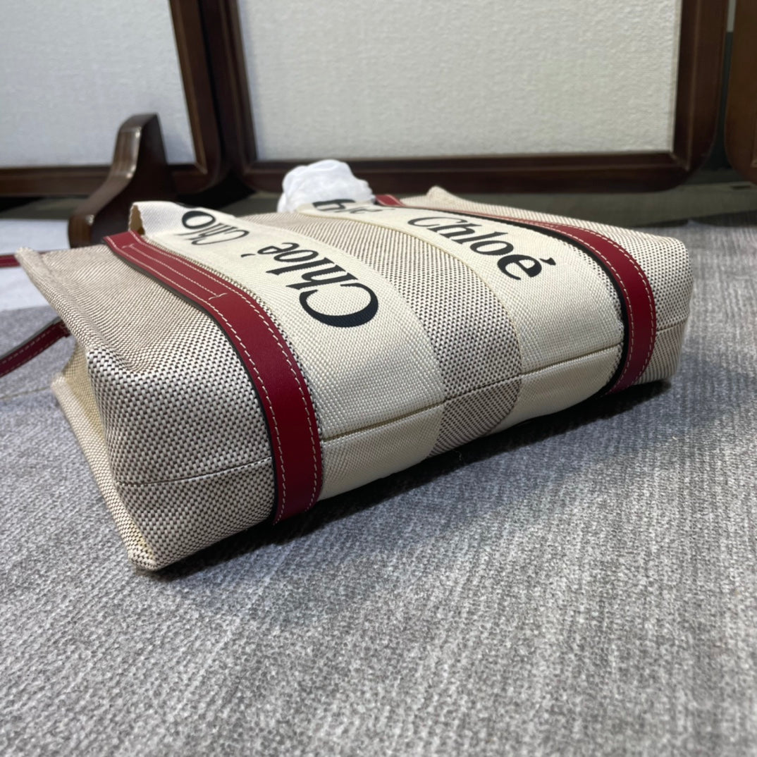 Small Strap Woody Tote Bag 26.5 in Beige Linen Canvas Black Webbing Logo Embroider Red Calfskin
