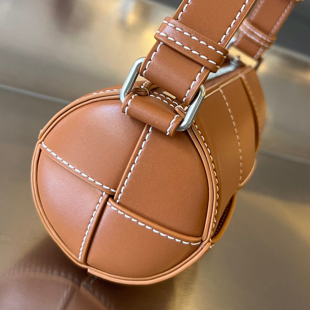 Bottega Veneta Small Cylinder Cassette 21 in Raw Sienna Calfskin Bag