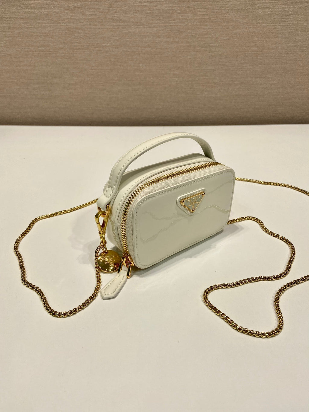 Prada Mini Hand Bag 11 with Gold Strap in White Patent Calfskin