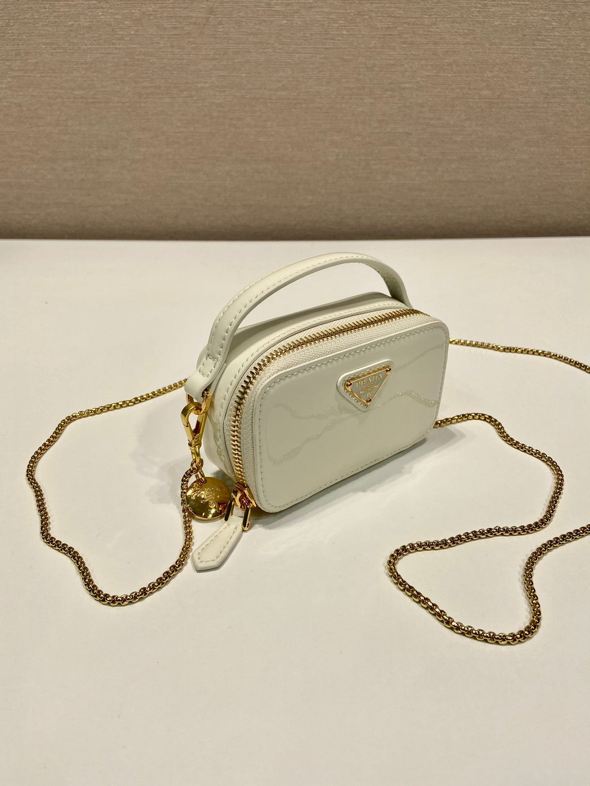 Prada Mini Hand Bag 11 with Gold Strap in White Patent Calfskin