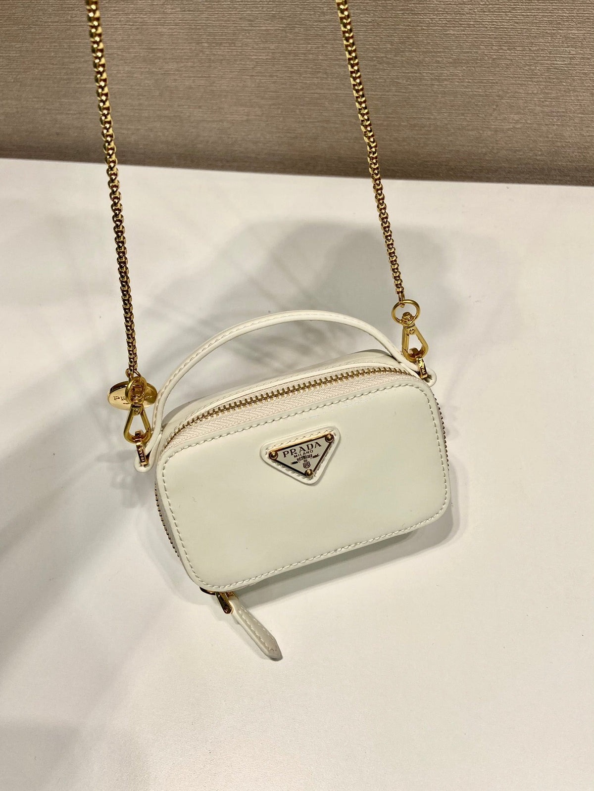 Prada Mini Hand Bag 11 with Gold Strap in White Patent Calfskin